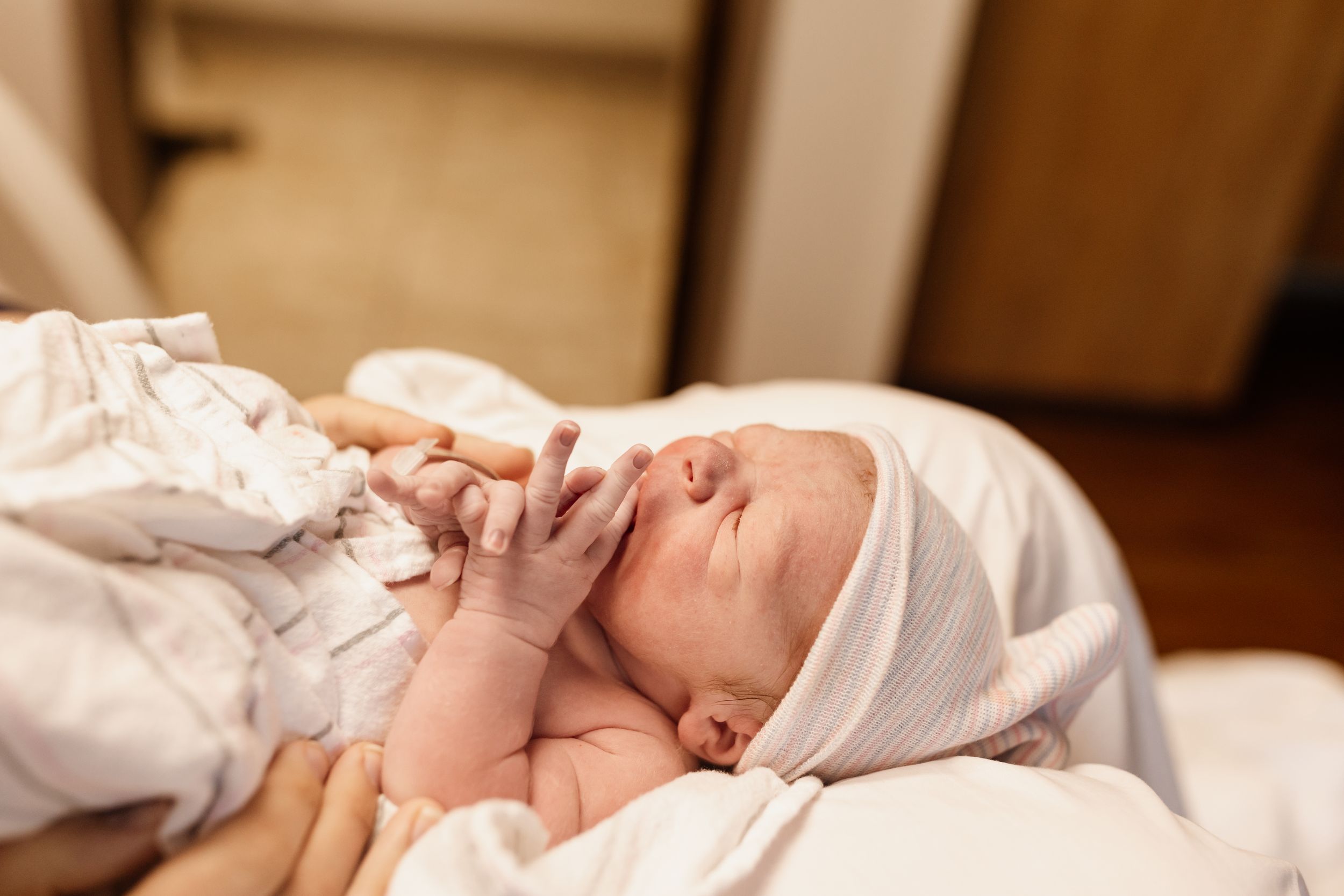 New baby during birth photography session in Marion Indiana