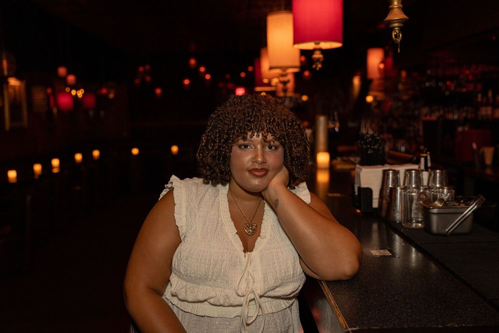 Moody nighttime bar scene with glowing red lights and ambient atmosphere.