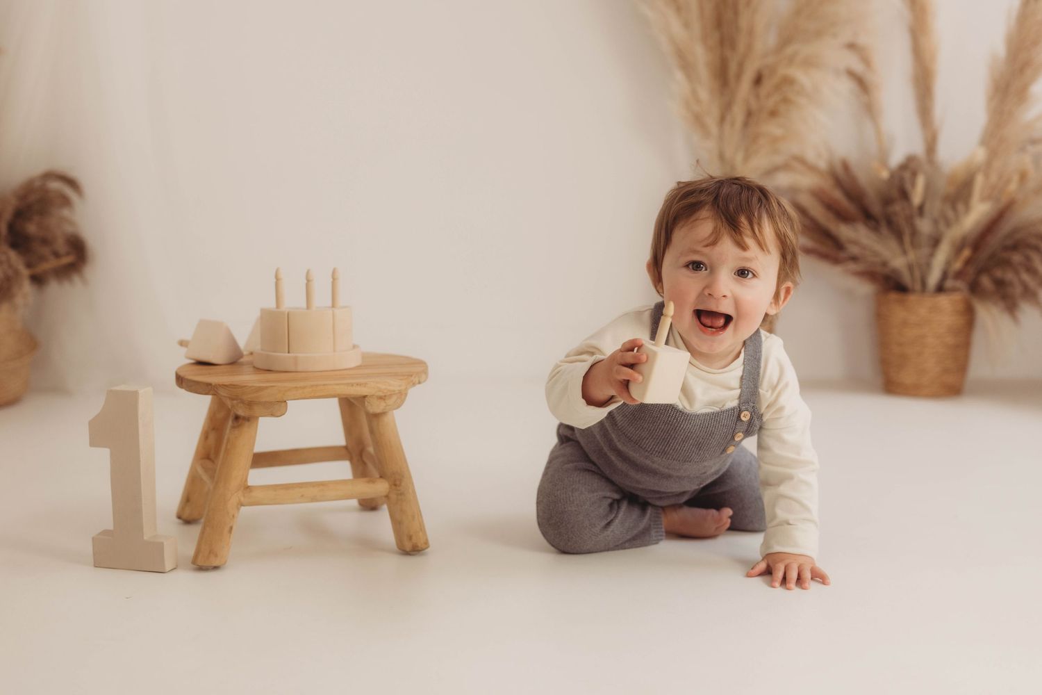 Tender moment between parent and baby in cozy knit sweater.