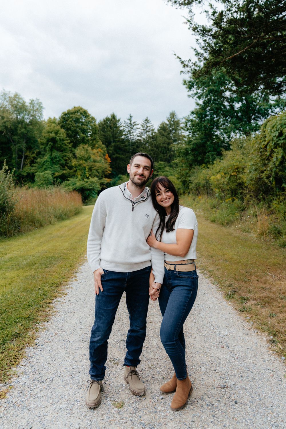 Candid moments of a couple enjoying time together on a nature trail.