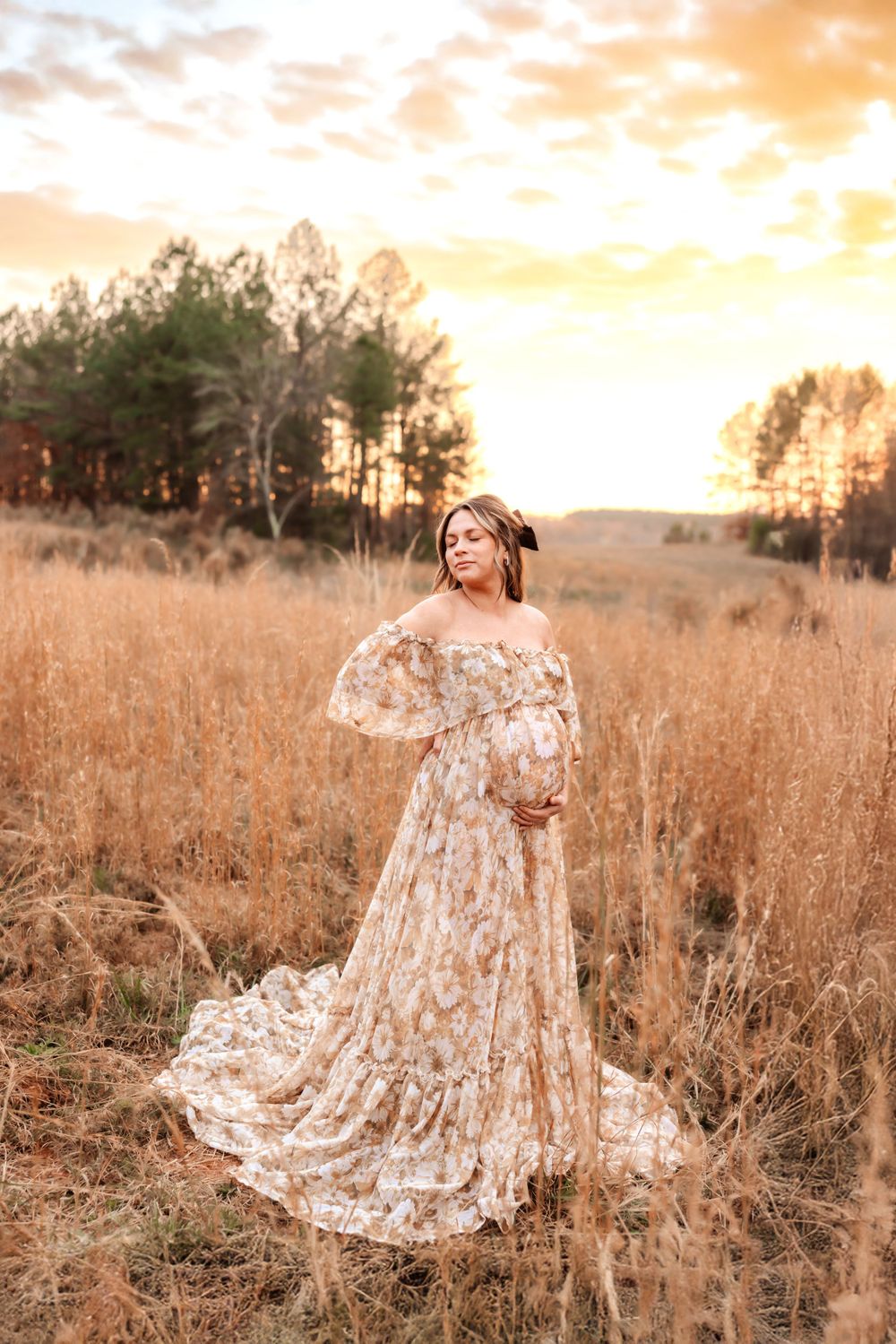 Expecting mother in neutral dress during maternity photoshoot in Mooresville NC