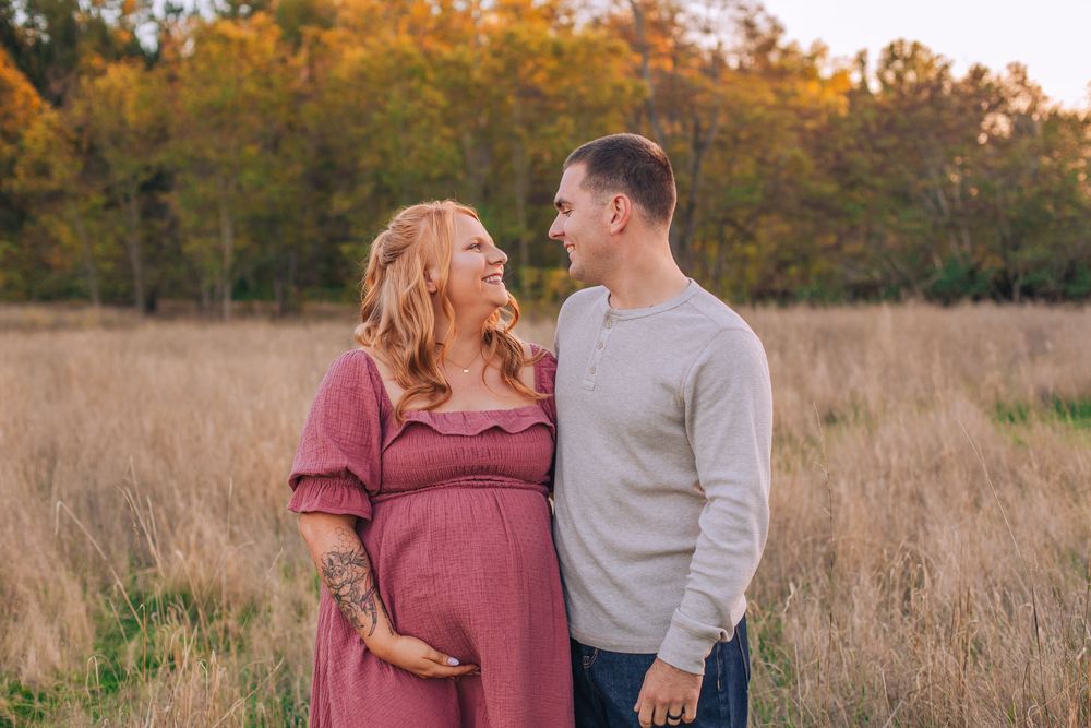 A family maternity session captured in a rustic field during autumn. Fedore Photography Spokane Liberty Lake Photographer Senior