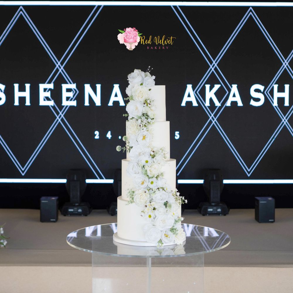 4 tier double barrel white wedding cake with white flowers