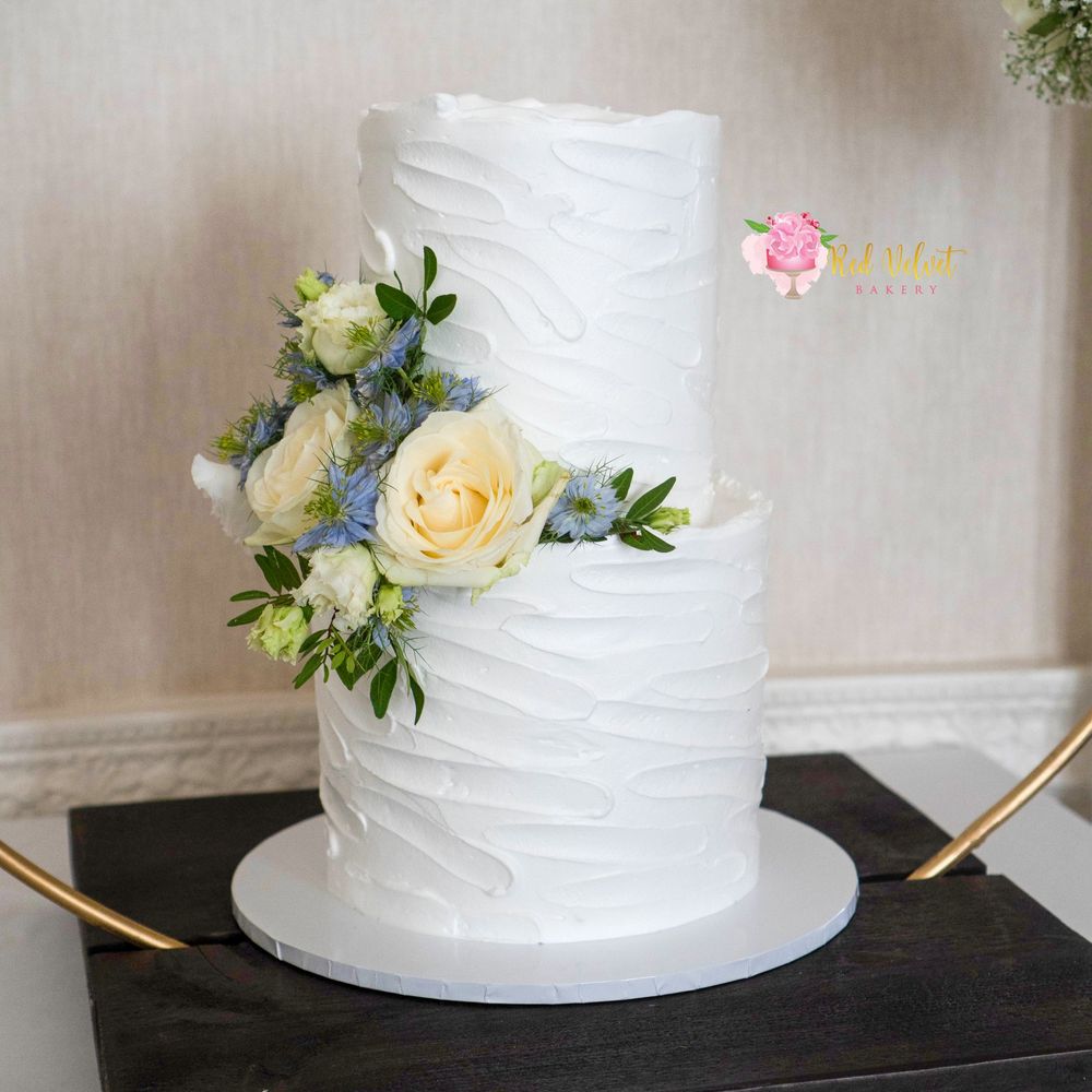 2 tier double barrel buttercream finished wedding cake