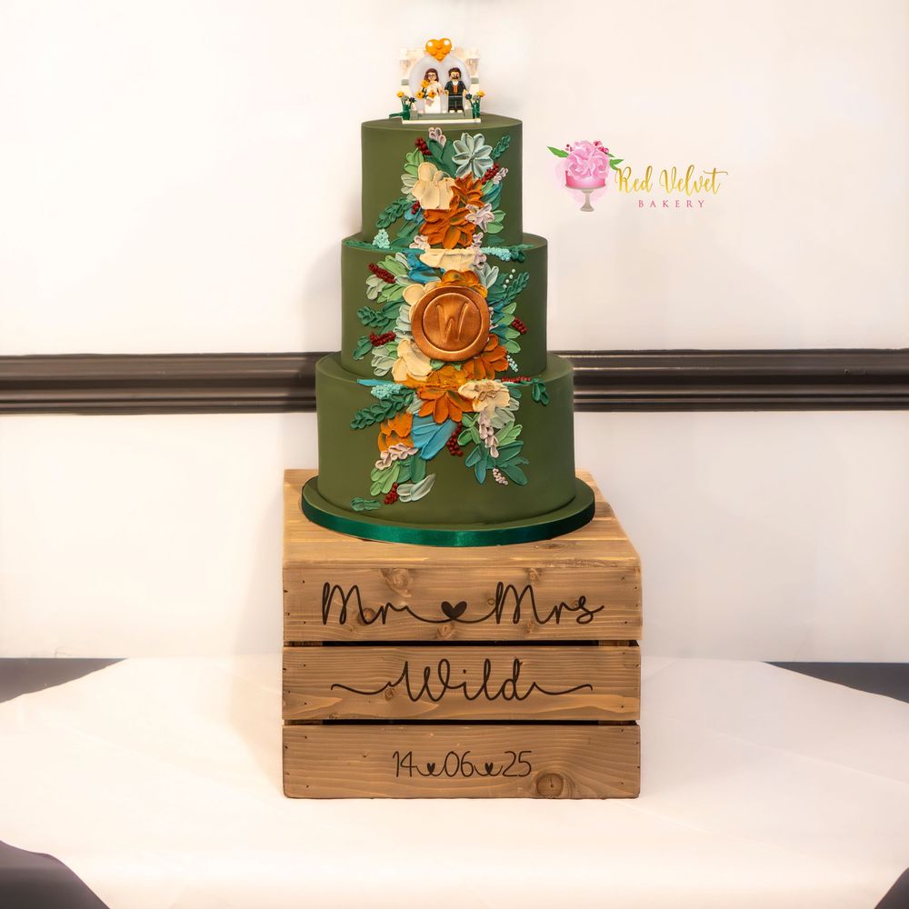 3 tier dark green fondant wedding cake with buttercream flower details