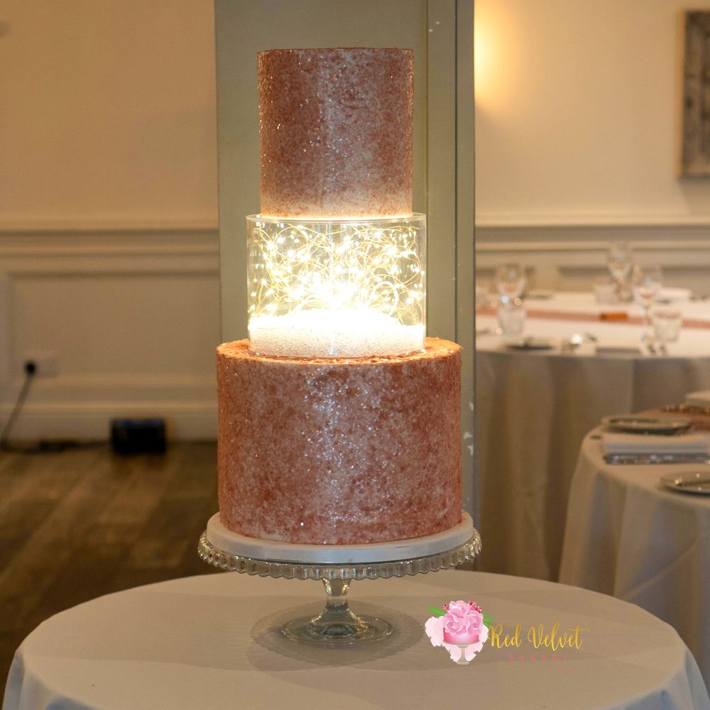 2 tier rose gold wedding cake with lightbox separator