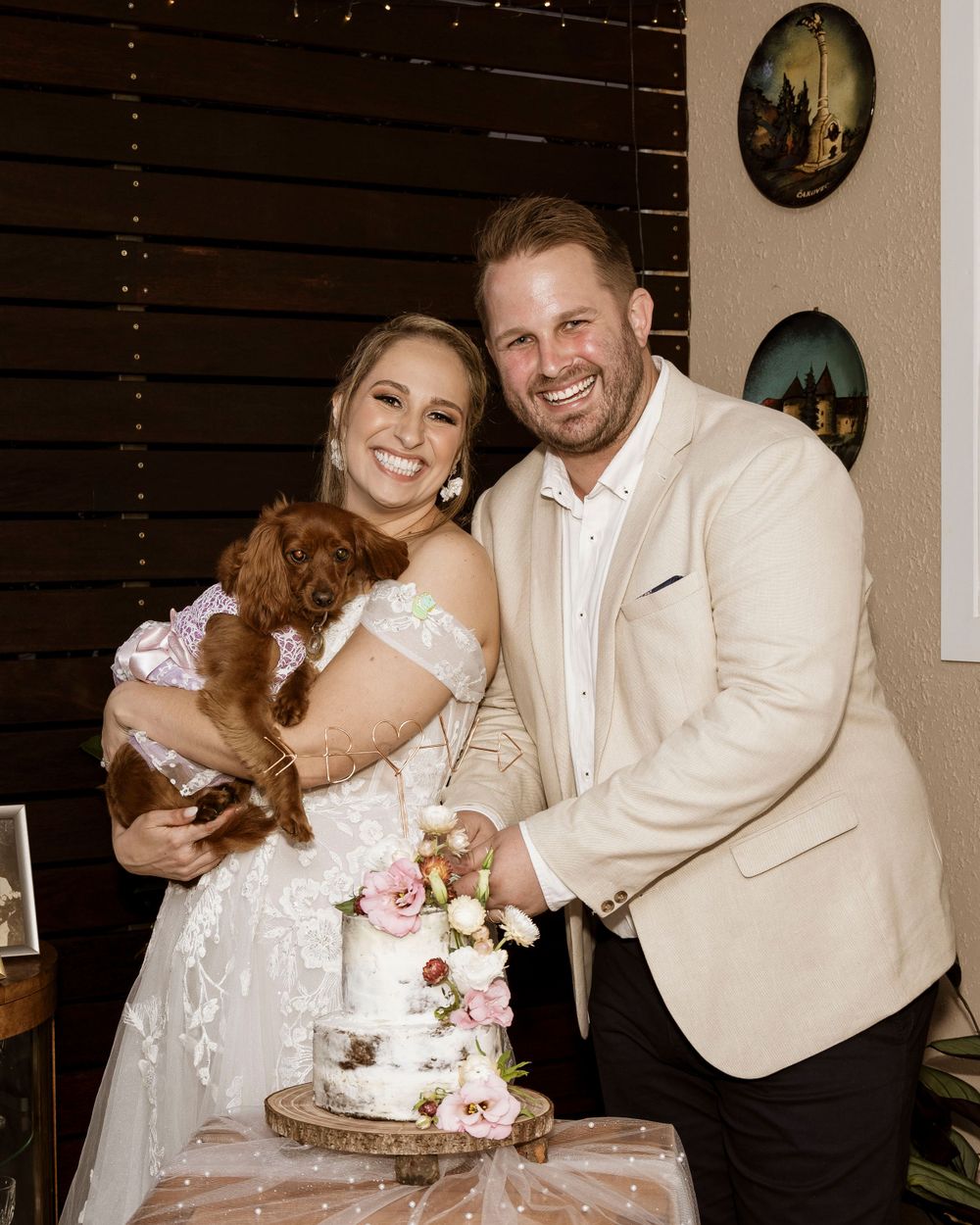 Couples cutting their wedding cake