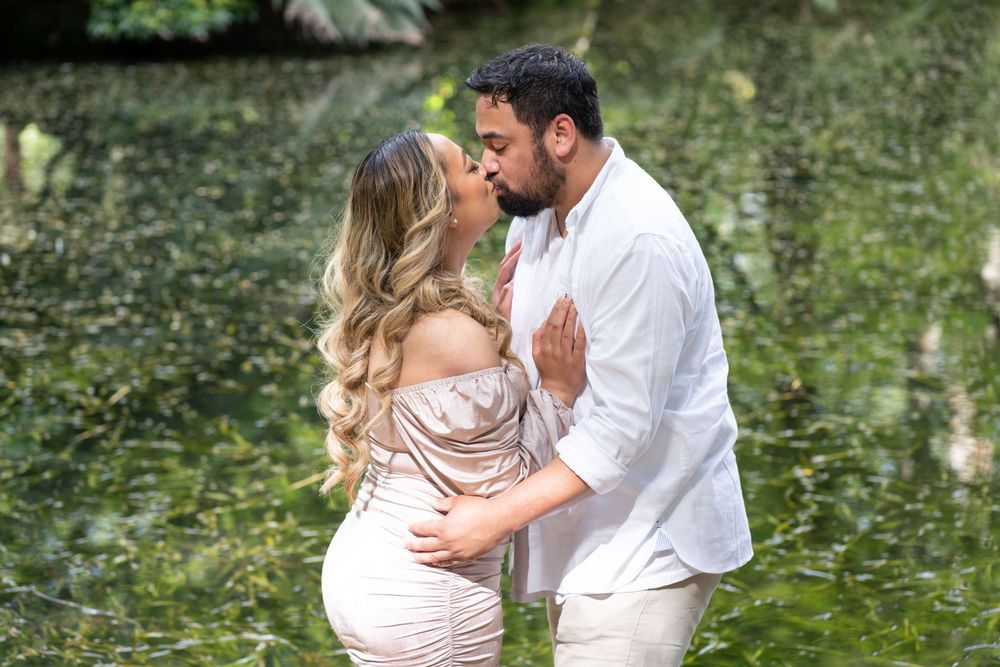 Sharing a kiss between engaged couple during photoshoot