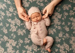 NH Newborn Photographer New Hampshire Newborn Photographer NH Photographer newborn holding parents hands in studio