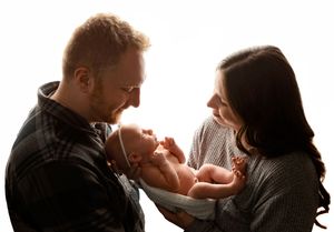 NH Newborn Photographer New Hampshire Newborn Photographer NH Photographer newborn with parents in studio