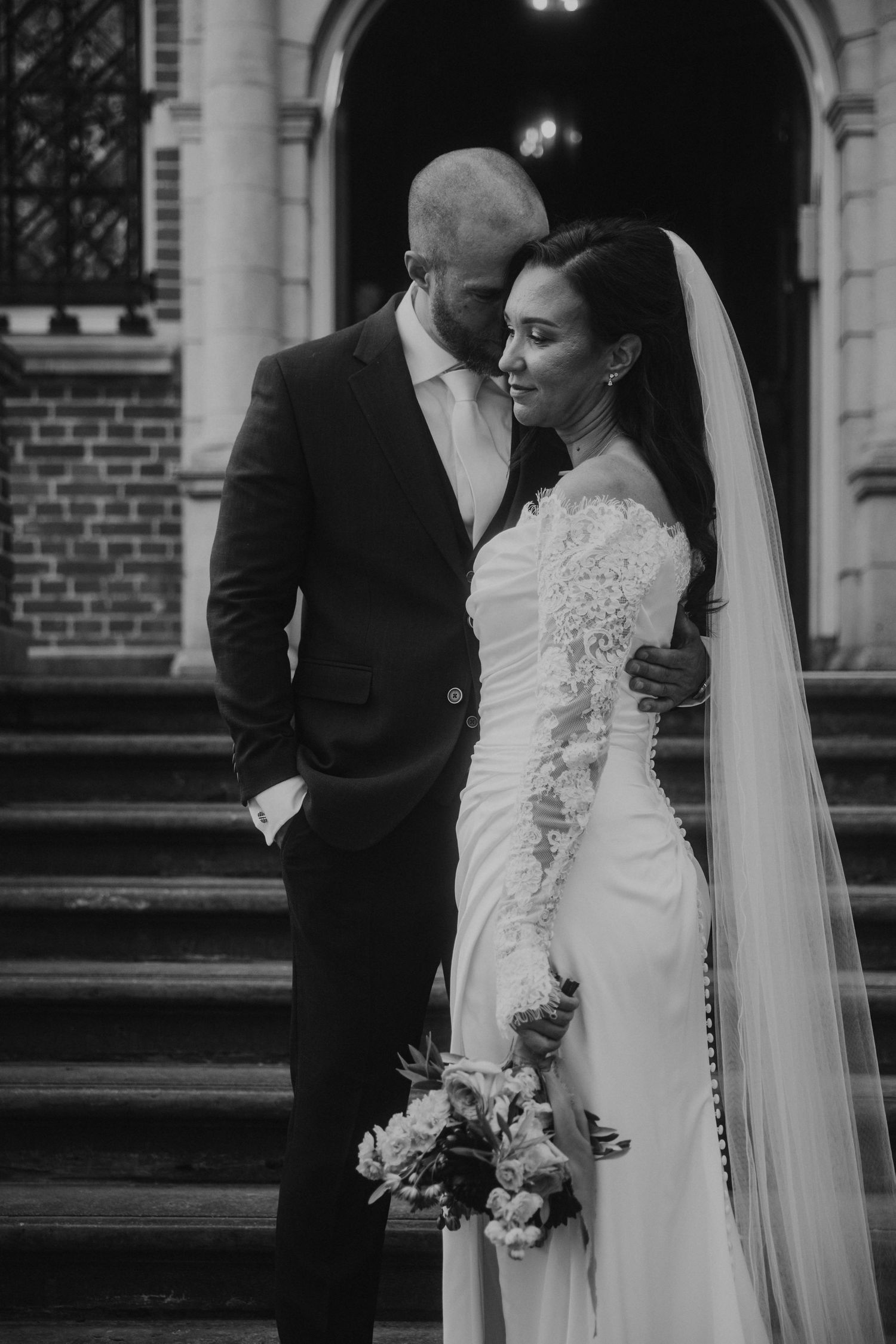 A black and white wedding photograph series showing romantic moments between the couple on church steps.