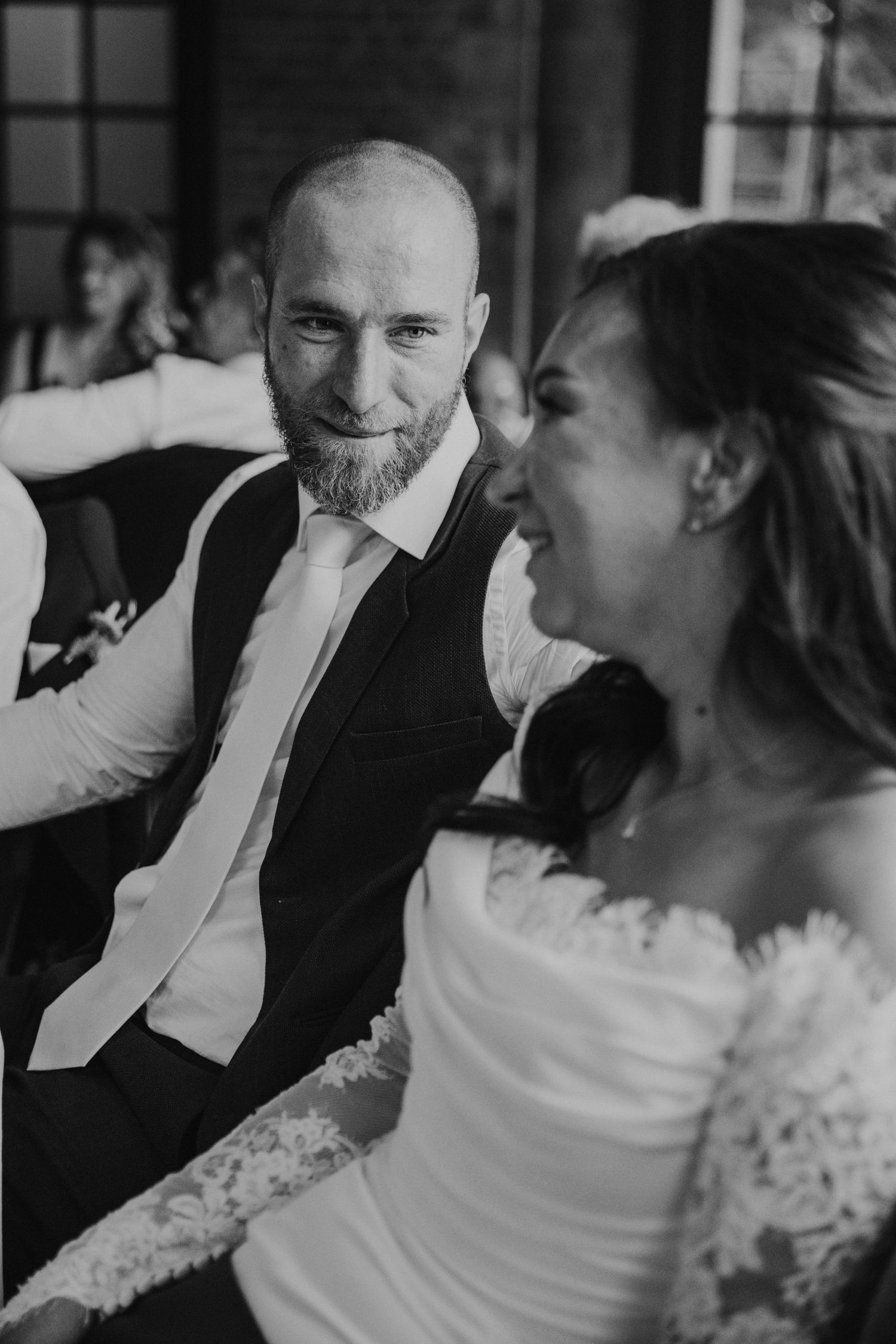 Black and white wedding photo sequence showing a couple sharing an intimate moment during their first dance.