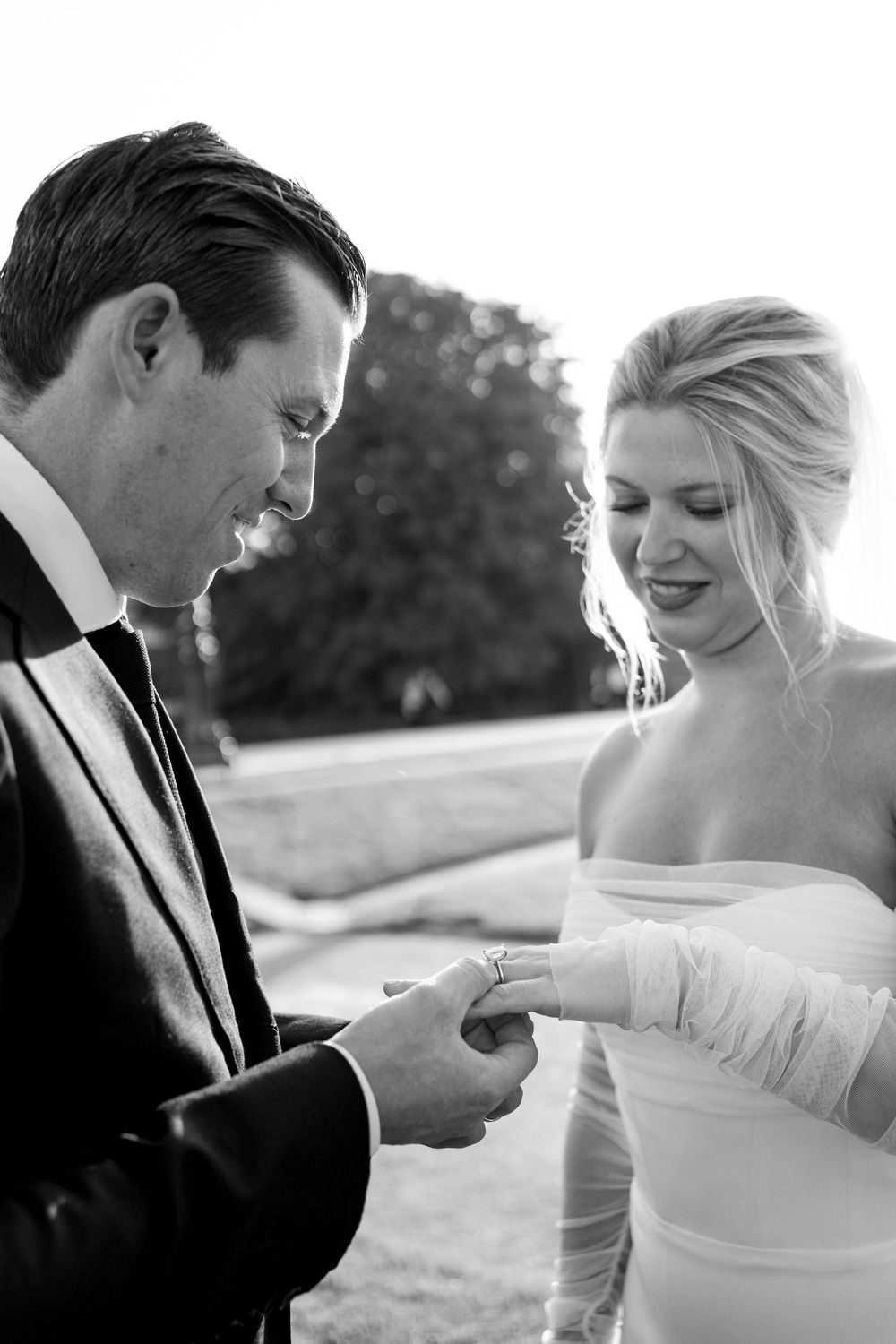 Black and white wedding sequence showing intimate moments between a couple in formal attire. Paris editorial elopement photographer.