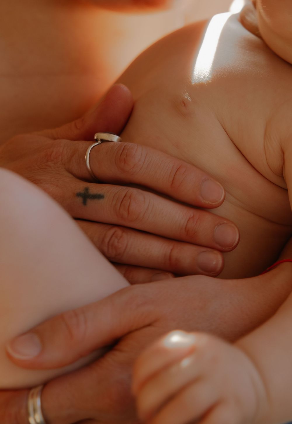 A close-up view of hands giving a relaxing massage therapy treatment on bare skin.