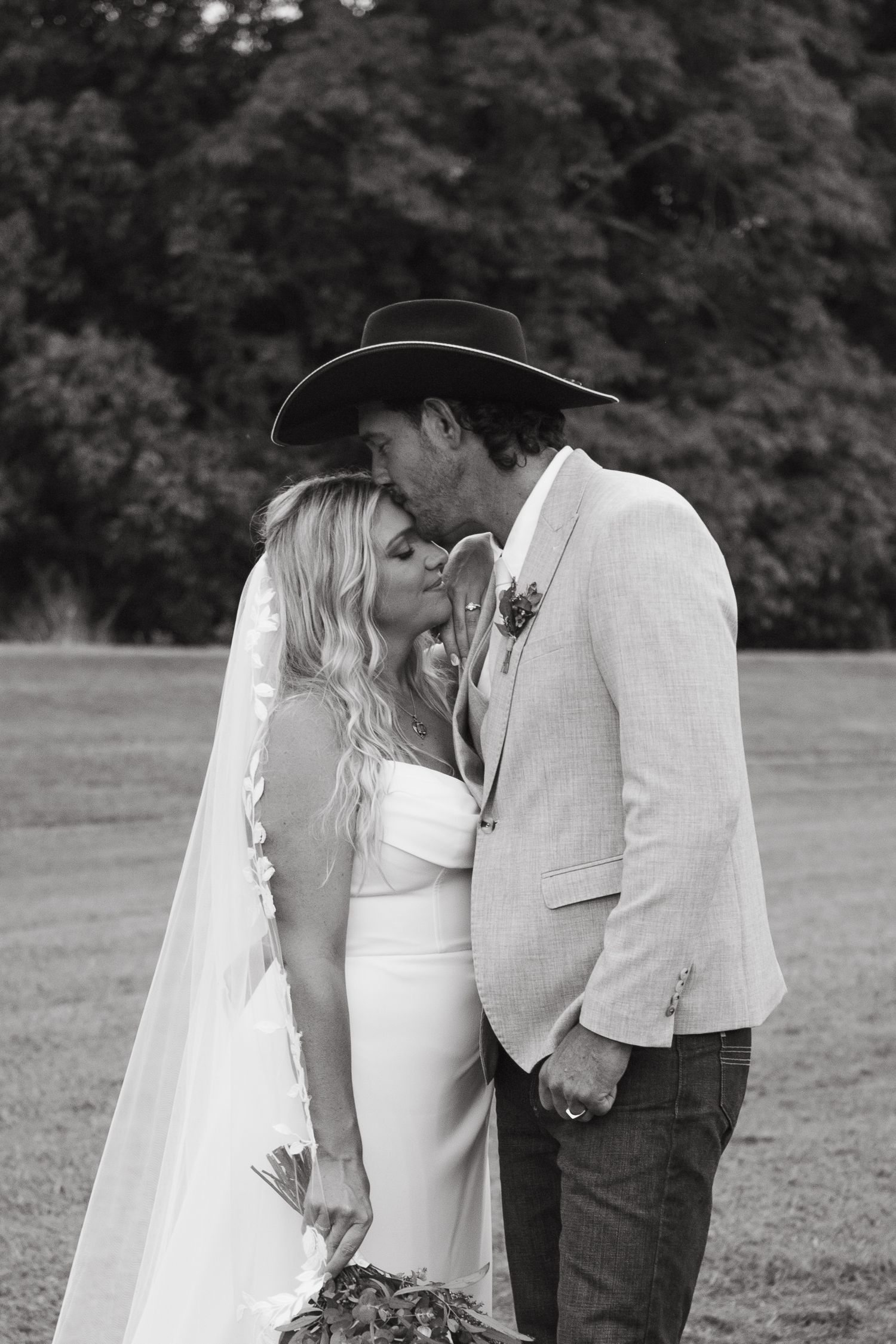 Bride and groom kissing at Country wedding in Port Douglas QLD