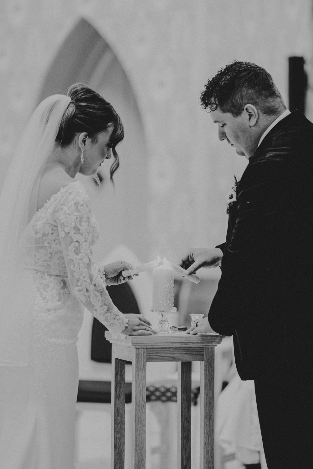 Black and white photo series showing tender moments between a couple during their wedding ceremony.