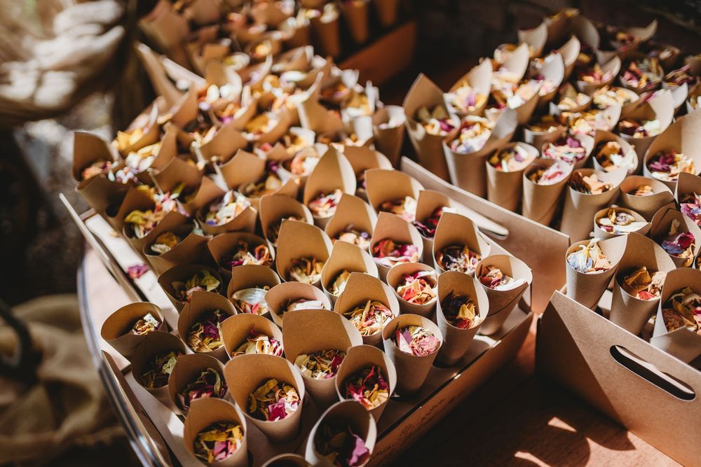 Wedding favors or treats arranged in rows of small paper cones.