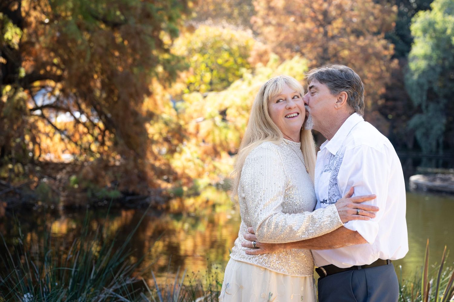 Romantic outdoor couple photography session in golden autumn light.