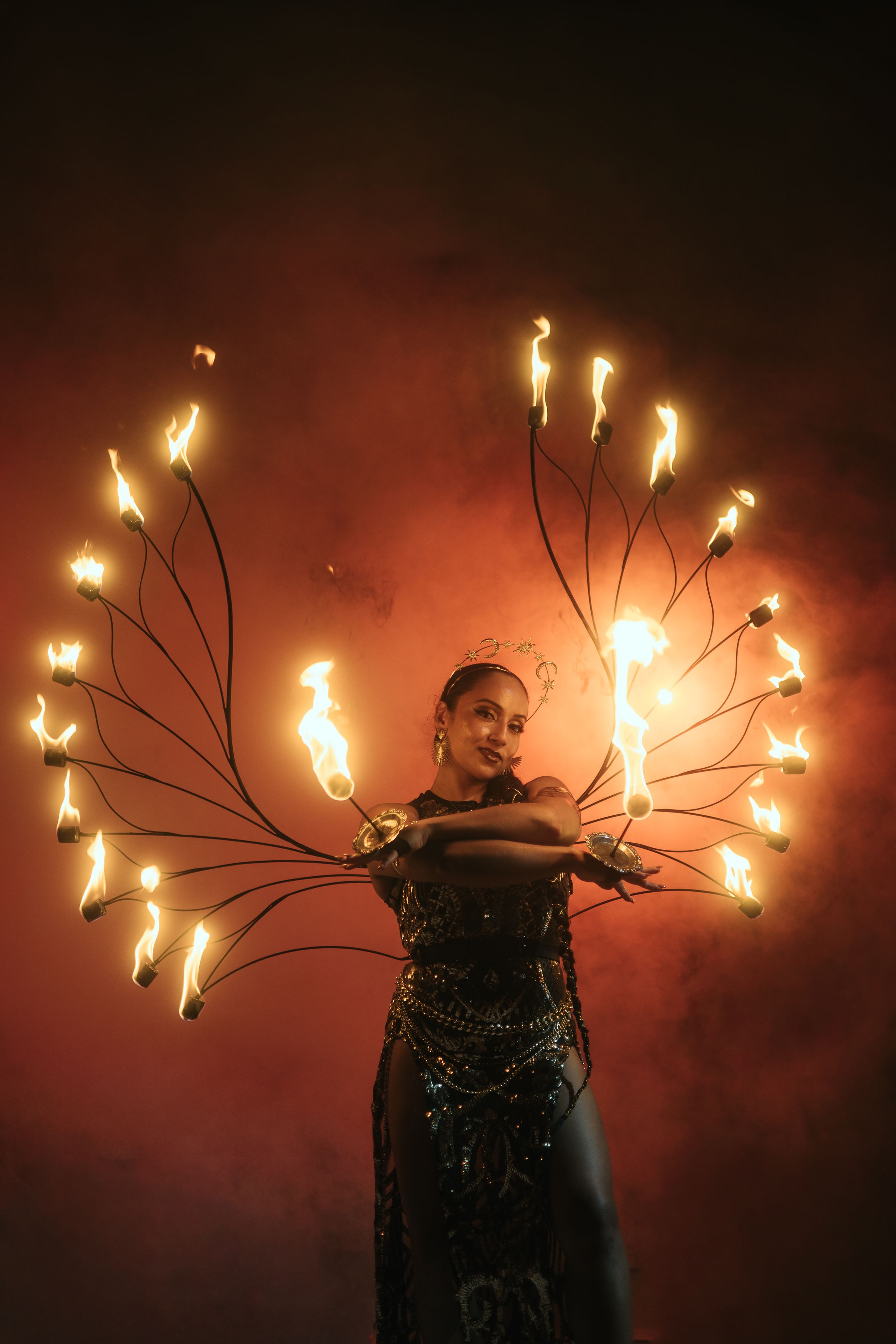 West Palm Beach fire artist captured by Mannyportraits. Symmetrical flame choreography and elegant performer posture.