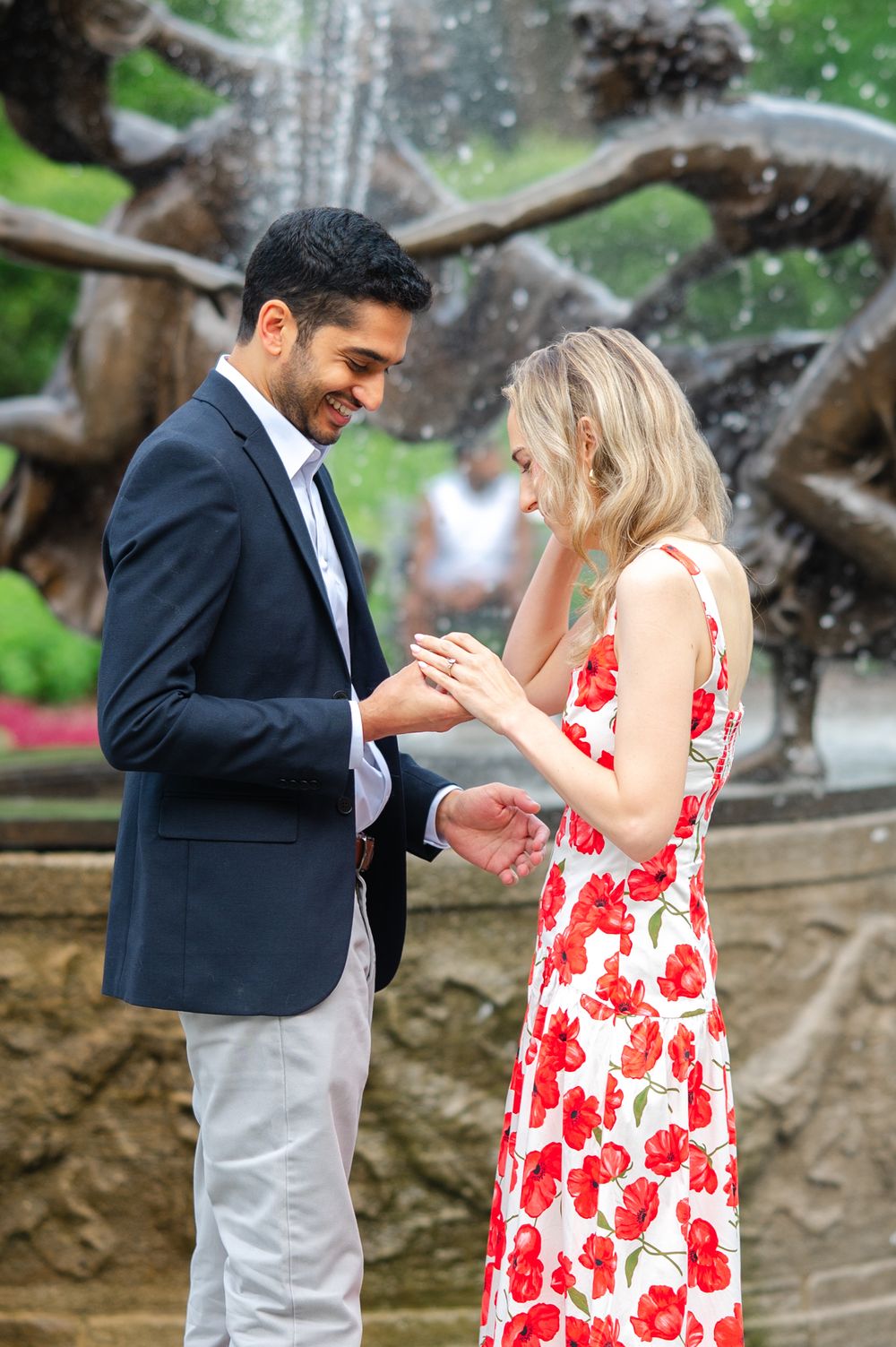 A special moment captured in front of the Untermyer Garden in Central Park as a couple celebrates their engagement.