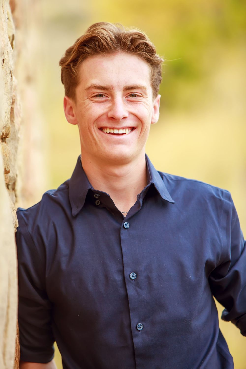 A sequence of close-up portraits showing someone wearing a navy polo shirt outdoors with natural lighting.