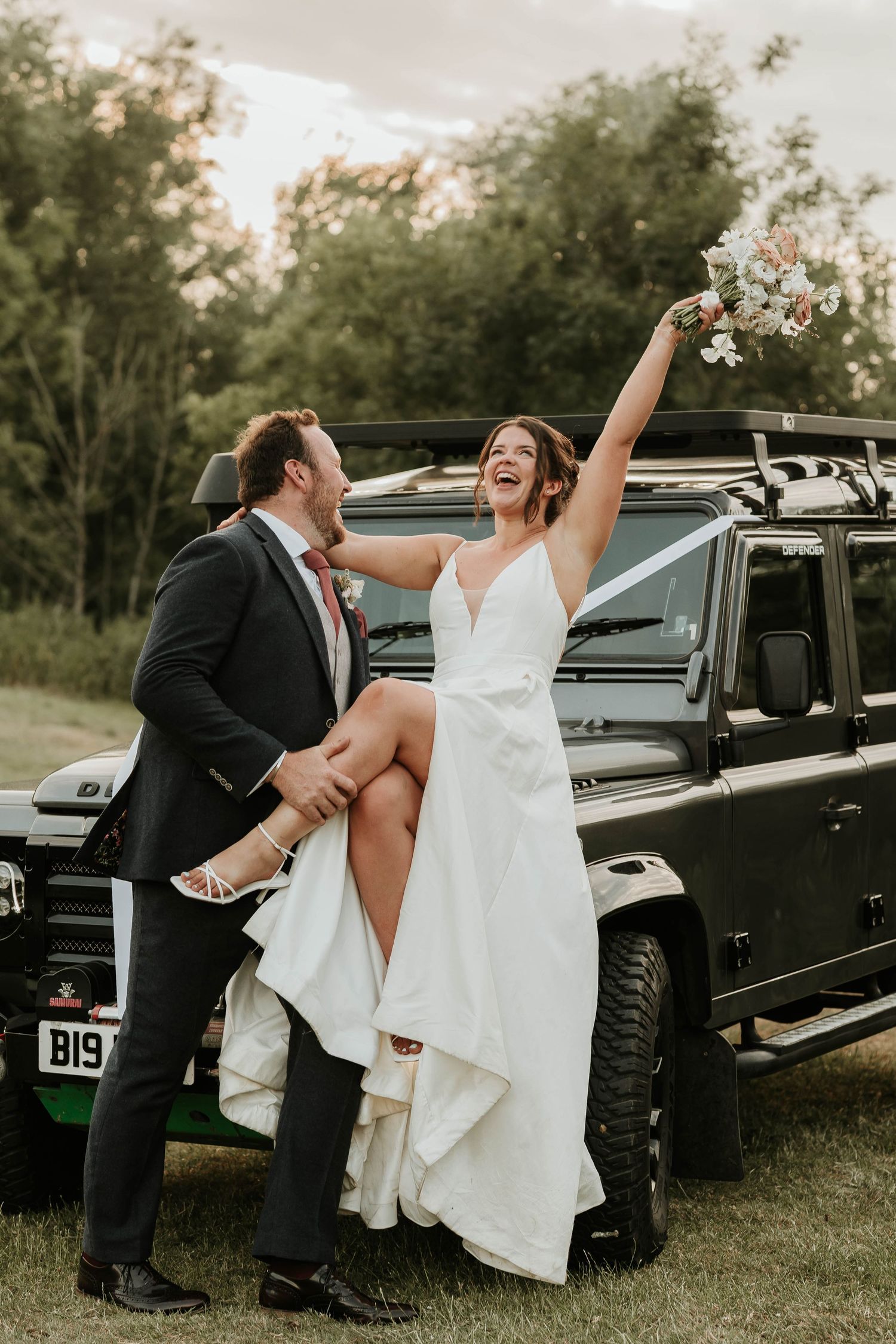 A sequence of candid wedding photos showing a couple sharing joyful moments near their black luxury vehicle.