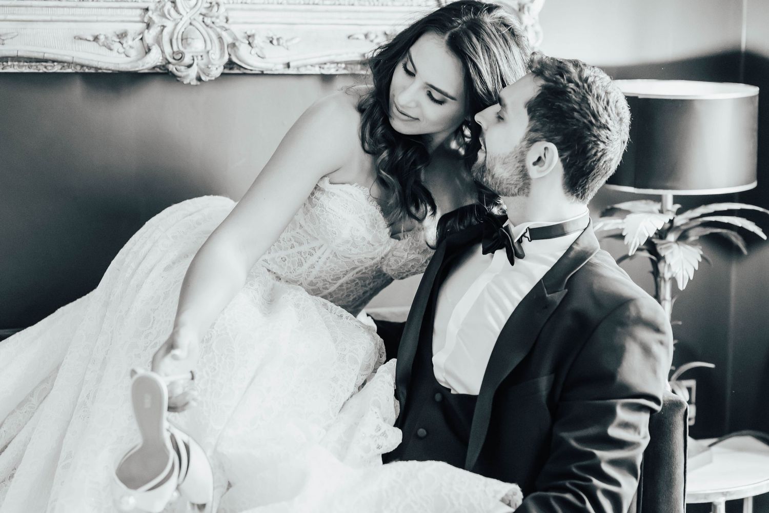 A series of black and white romantic wedding moments showing couples embracing and sharing intimate moments.