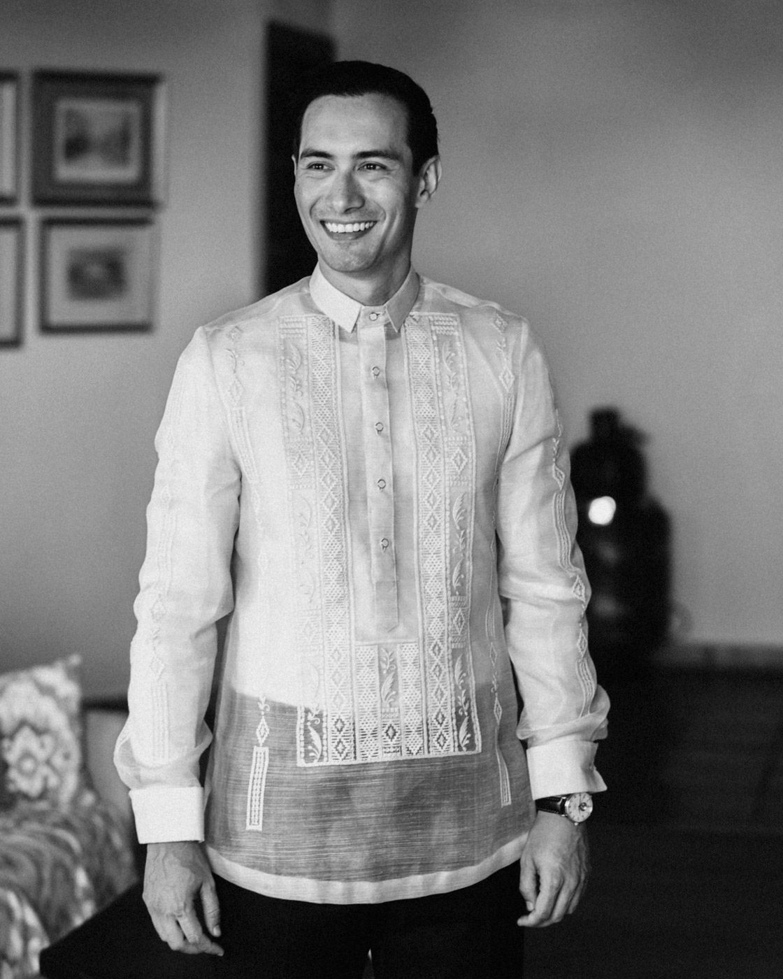 Classic black and white portrait showing someone wearing a traditional Filipino barong tagalog formal shirt.