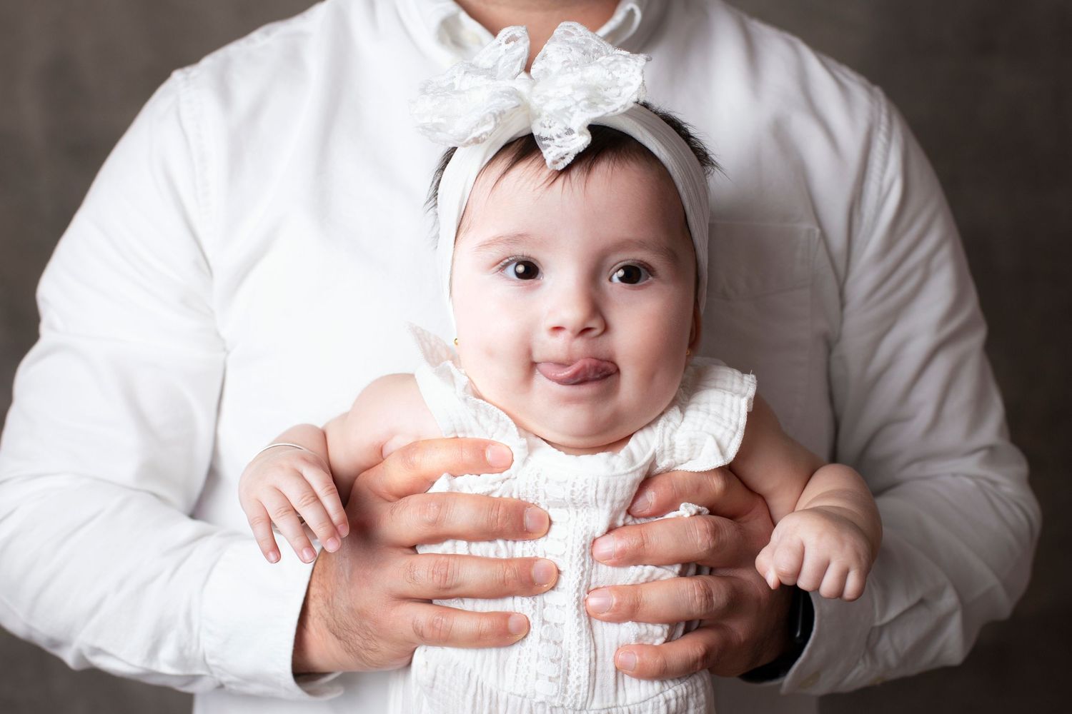A collection of cute images showing a baby in white clothing against a light background.