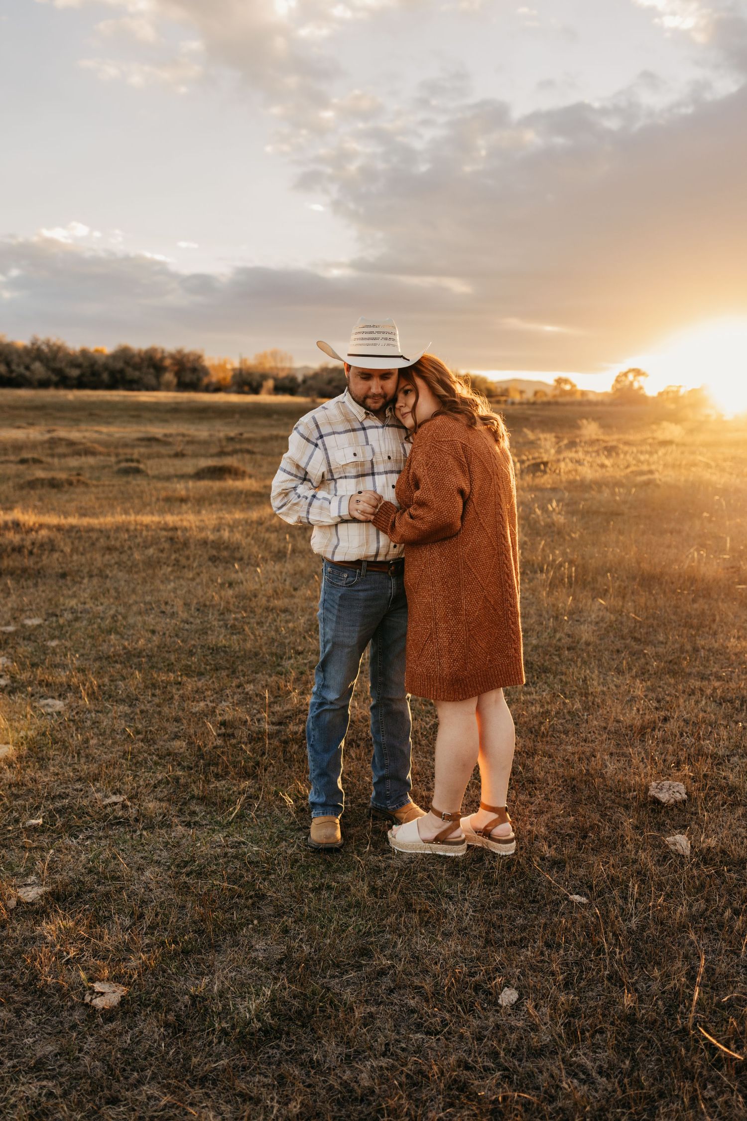 Couple staring into each others eyes show casing their love during their engagement session.