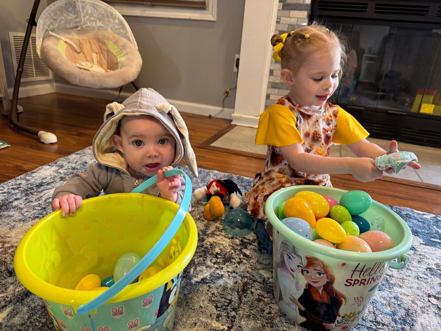 Springfield, IL family photographer shares insight to her personal life with a picture of her kids opening Easter eggs after an Easter hunt.