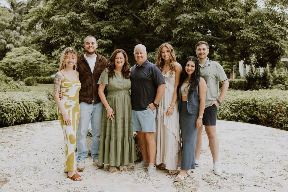 Large family photos in Downtown Palm Beach on the island, at a park and the beach captured by Lindsay McDow Photography