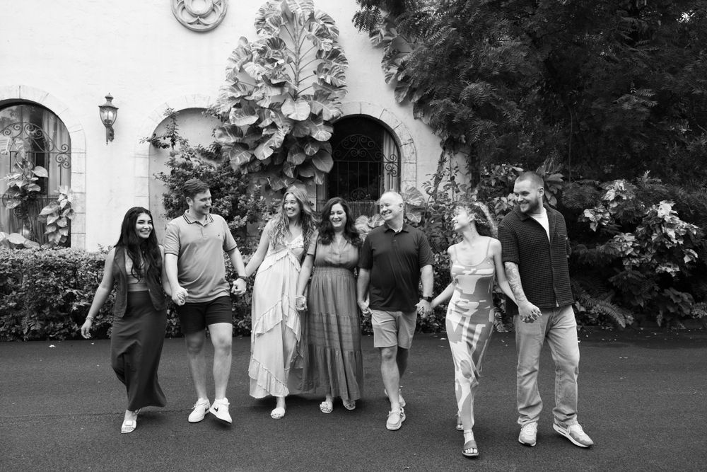 Large family photos in Downtown Palm Beach on the island, at a park and the beach captured by Lindsay McDow Photography