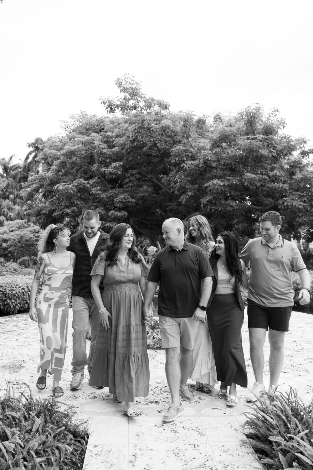 Large family photos in Downtown Palm Beach on the island, at a park and the beach captured by Lindsay McDow Photography