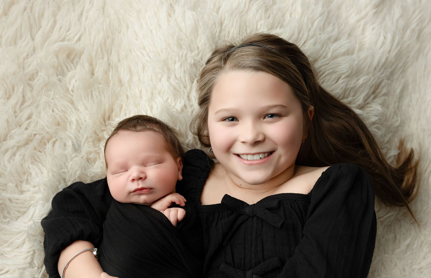Big sister holding newborn brother. Greenville SC newborn photographer, Easley, SC newborn photographer, Upstate newborn photographer