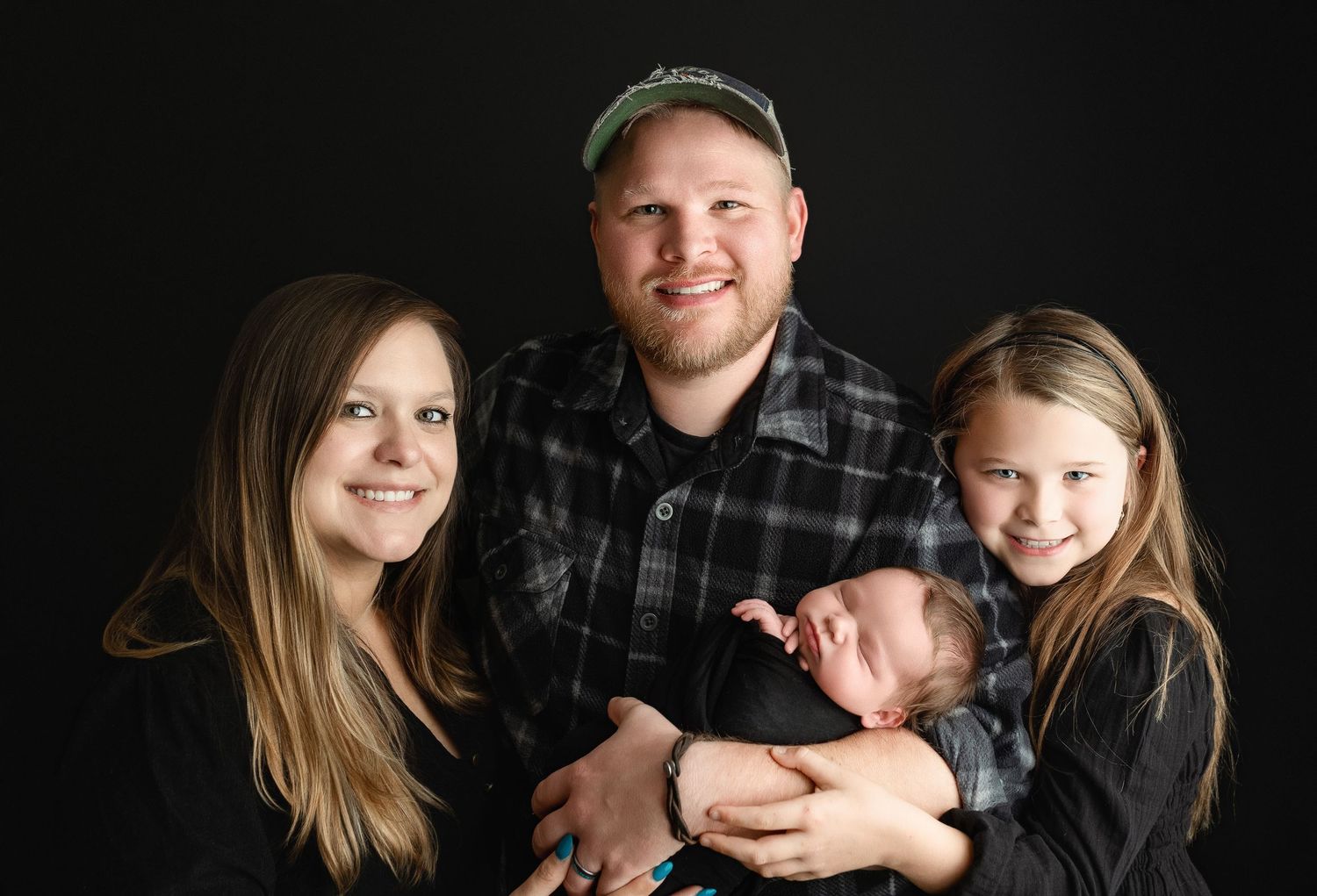 A family holding their newborn boy. Greenville SC newborn photographer, Easley, SC newborn photographer, Upstate newborn photographer