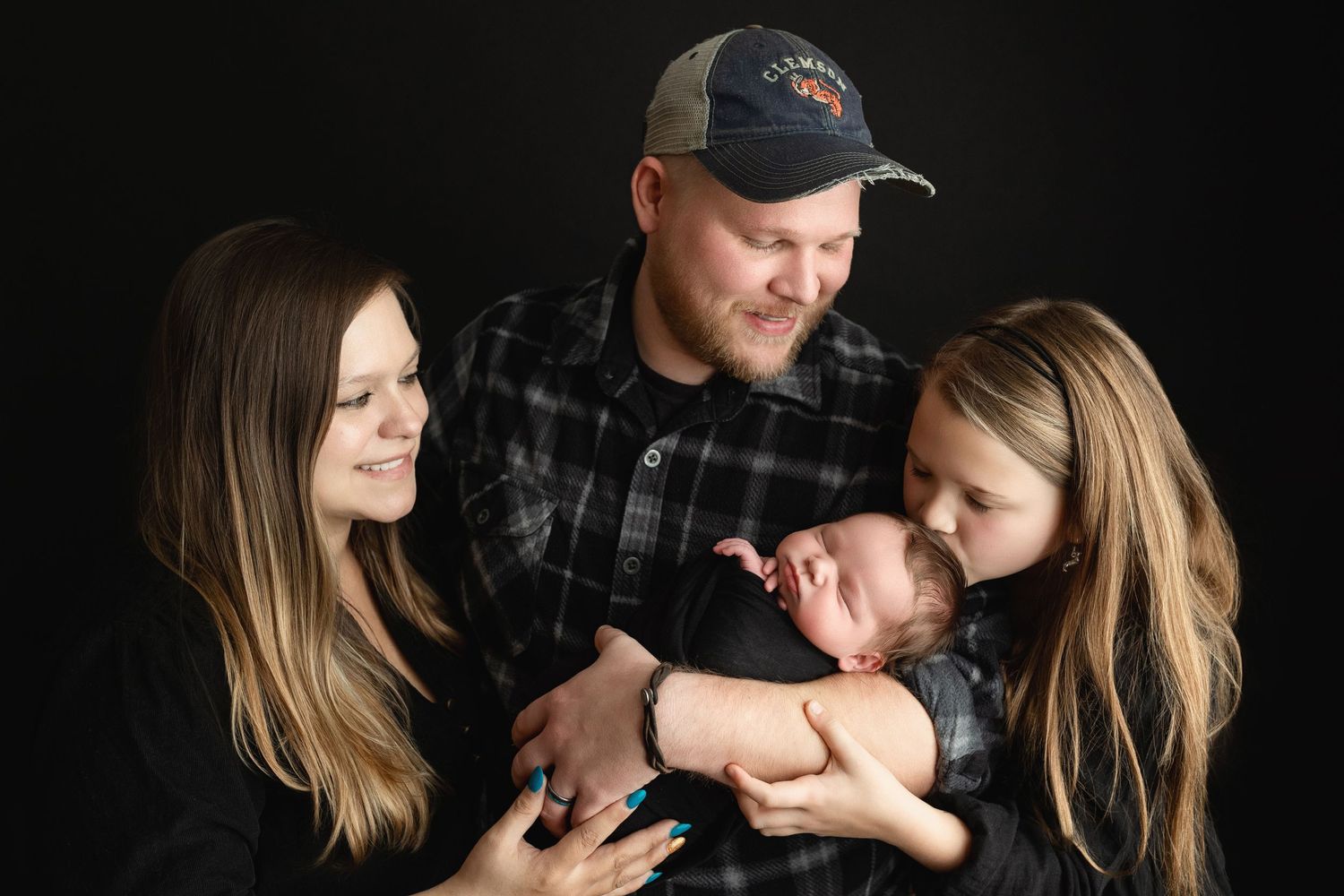 A family looking down at their newborn baby boy. Greenville SC newborn photographer, Easley, SC newborn photographer, Upstate newborn photog