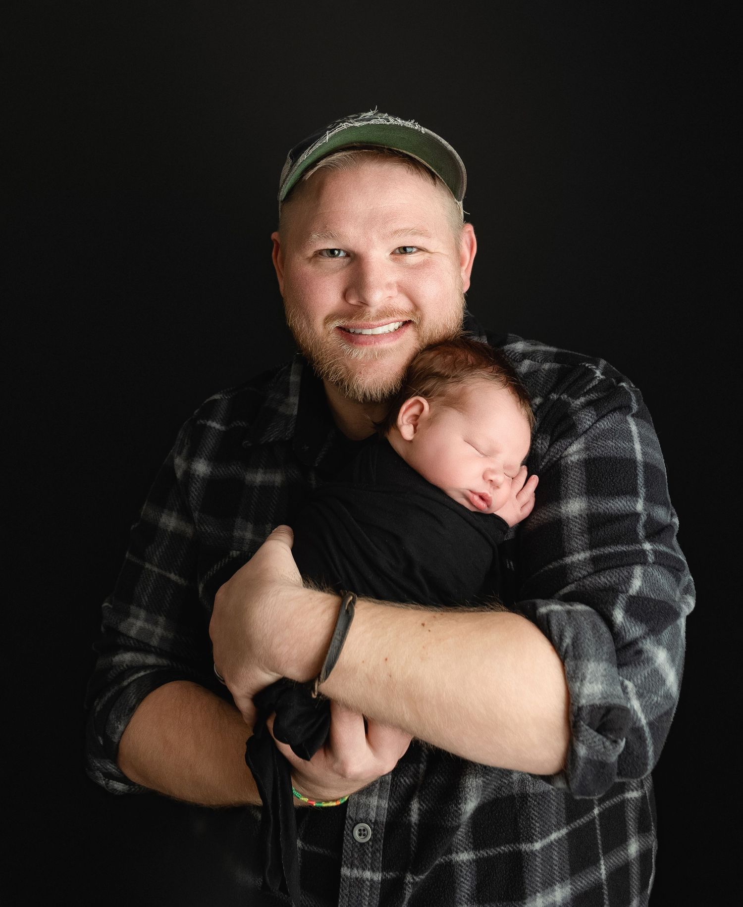 Father is holding his newborn boy. Greenville SC newborn photographer, Easley, SC newborn photographer, Upstate newborn photographer