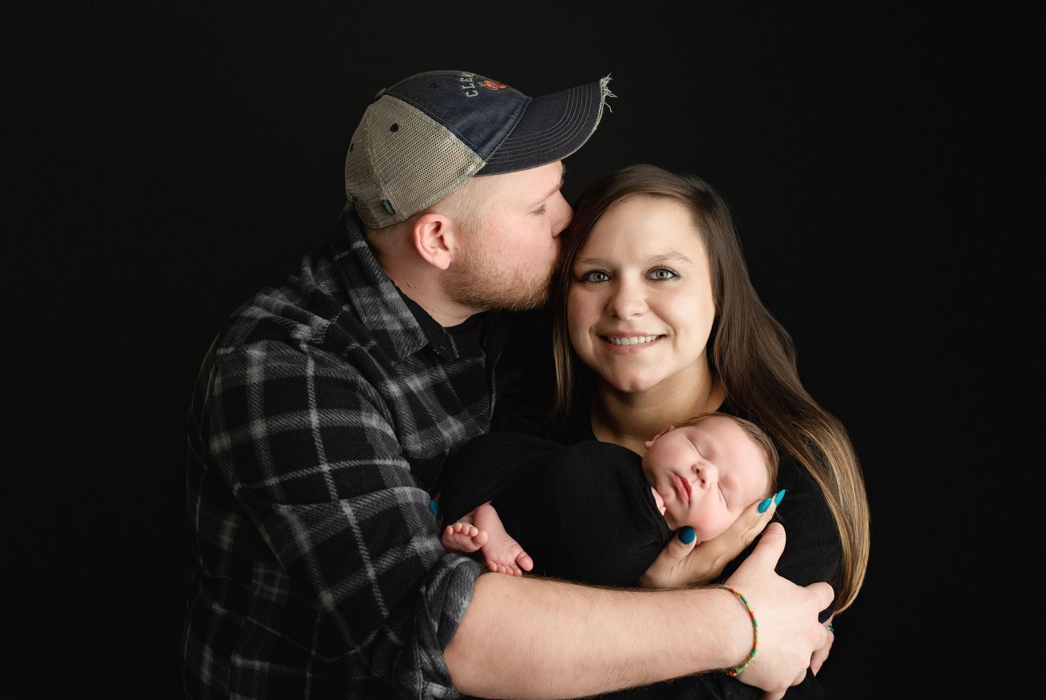 Mom and Dad are holding their newborn boy. Greenville SC newborn photographer, Easley, SC newborn photographer, Upstate newborn photographer