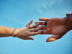 A series of hands reaching towards each other against a bright blue sky background.

Indiana Weddings
Illinois Weddings
Michigan Weddings
We