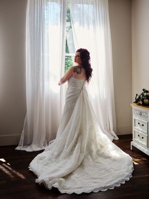 A bride in a flowing wedding gown poses near sheer curtained windows.

Indiana Weddings
Illinois Weddings
Michigan Weddings
Weddings