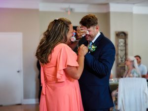 A sequence of intimate wedding moments shows a couple sharing emotional embraces in an indoor venue.