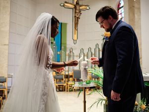 A couple lighting unity candle during their wedding ceremony.

Indiana Weddings
Illinois Weddings
Michigan Weddings
Weddings