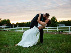 A bride and groom shares romantic moments in a grassy field with white fences at sunset.
Indiana Weddings
Illinois Weddings
Michigan Wedding