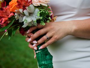 Close-up view of hands holding a bouquet of flowers against a wedding dress.

Indiana Weddings
Illinois Weddings
Michigan Weddings
Weddings