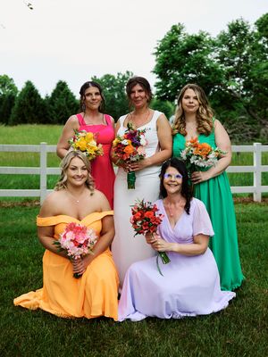 Bridesmaids in colorful dresses poses together on a lawn with white fence backdrop.

Indiana Weddings
Illinois Weddings
Michigan Weddings