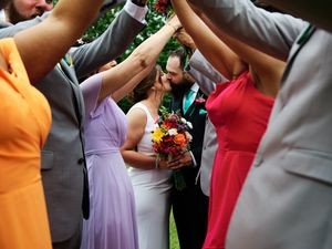 Wedding party members in colorful dresses and suits celebrates couple.

Indiana Weddings
Illinois Weddings
Michigan Weddings
Weddings