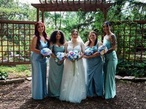 Bridesmaids poses under a wooden pergola in a garden setting.

Indiana Weddings
Illinois Weddings
Michigan Weddings
Weddings