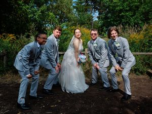 Wedding party posing playfully on ground in outdoor garden setting.

Indiana Weddings
Illinois Weddings
Michigan Weddings
Weddings