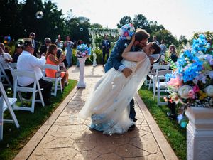 A dip kiss after ceremony along the aisle.

Indiana Weddings
Illinois Weddings
Michigan Weddings
Weddings